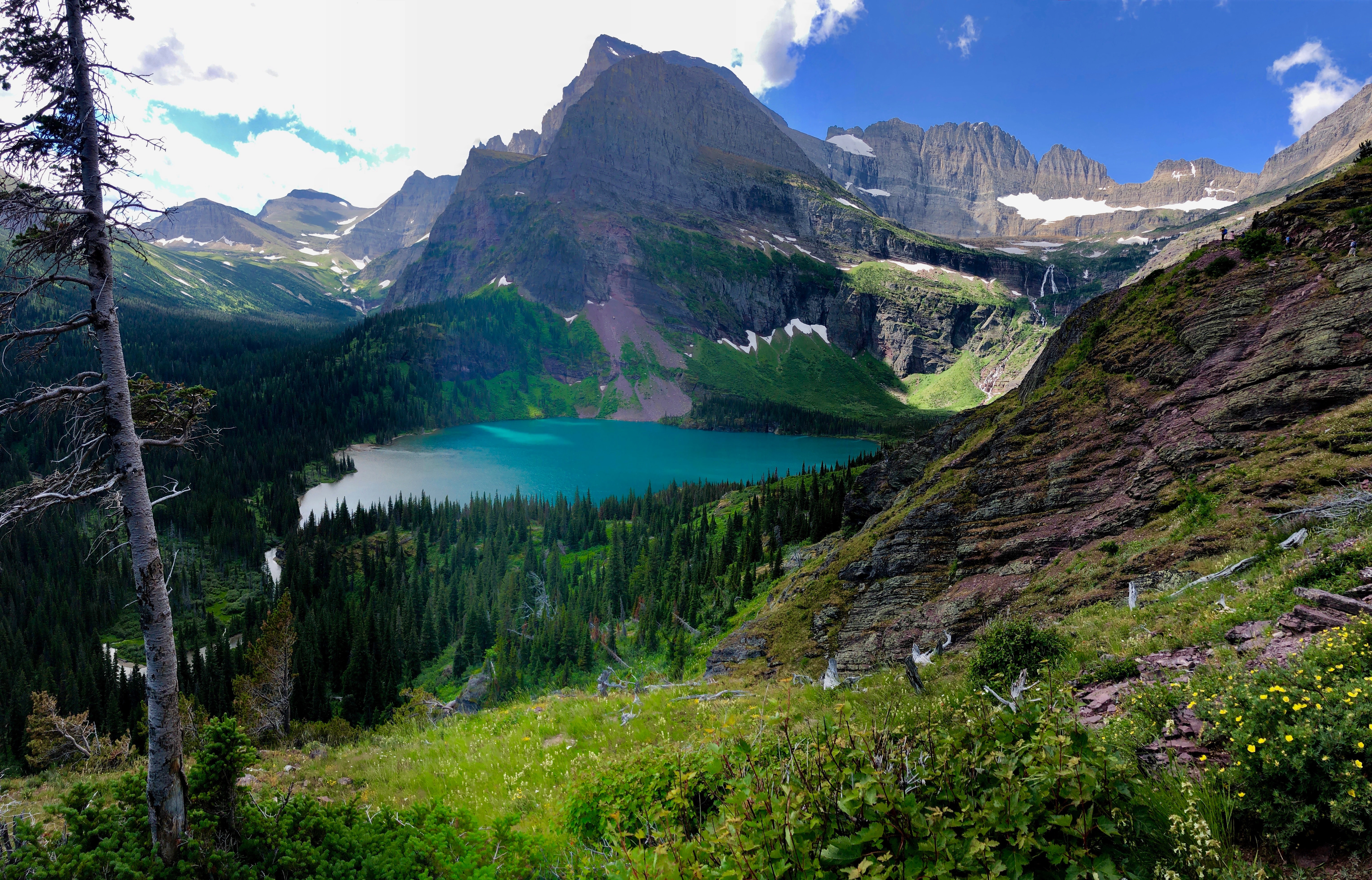 Turquoise colored alpine lake in a beautiful mountain landscape at Glacier National Park