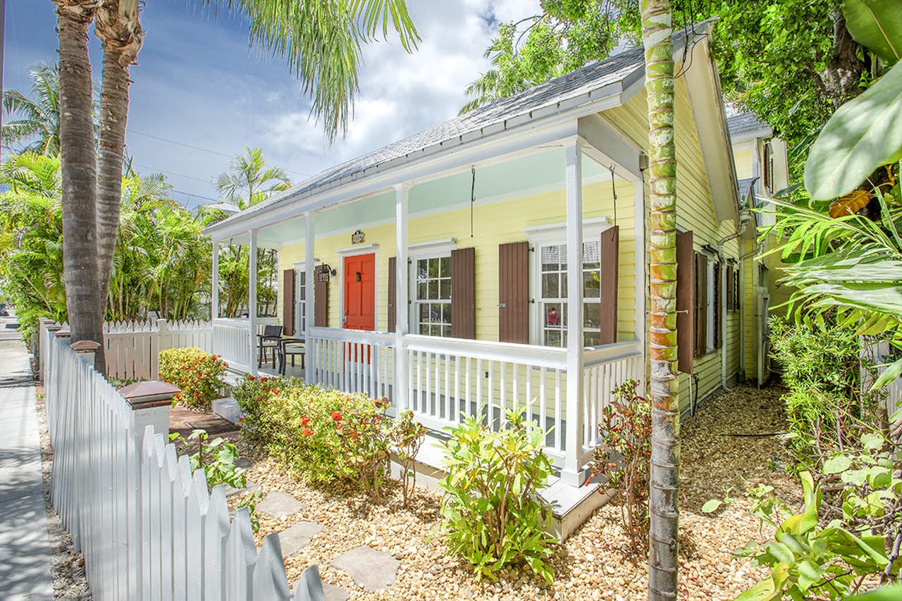 Porch of yellow vacation cottage in Key West, FL
