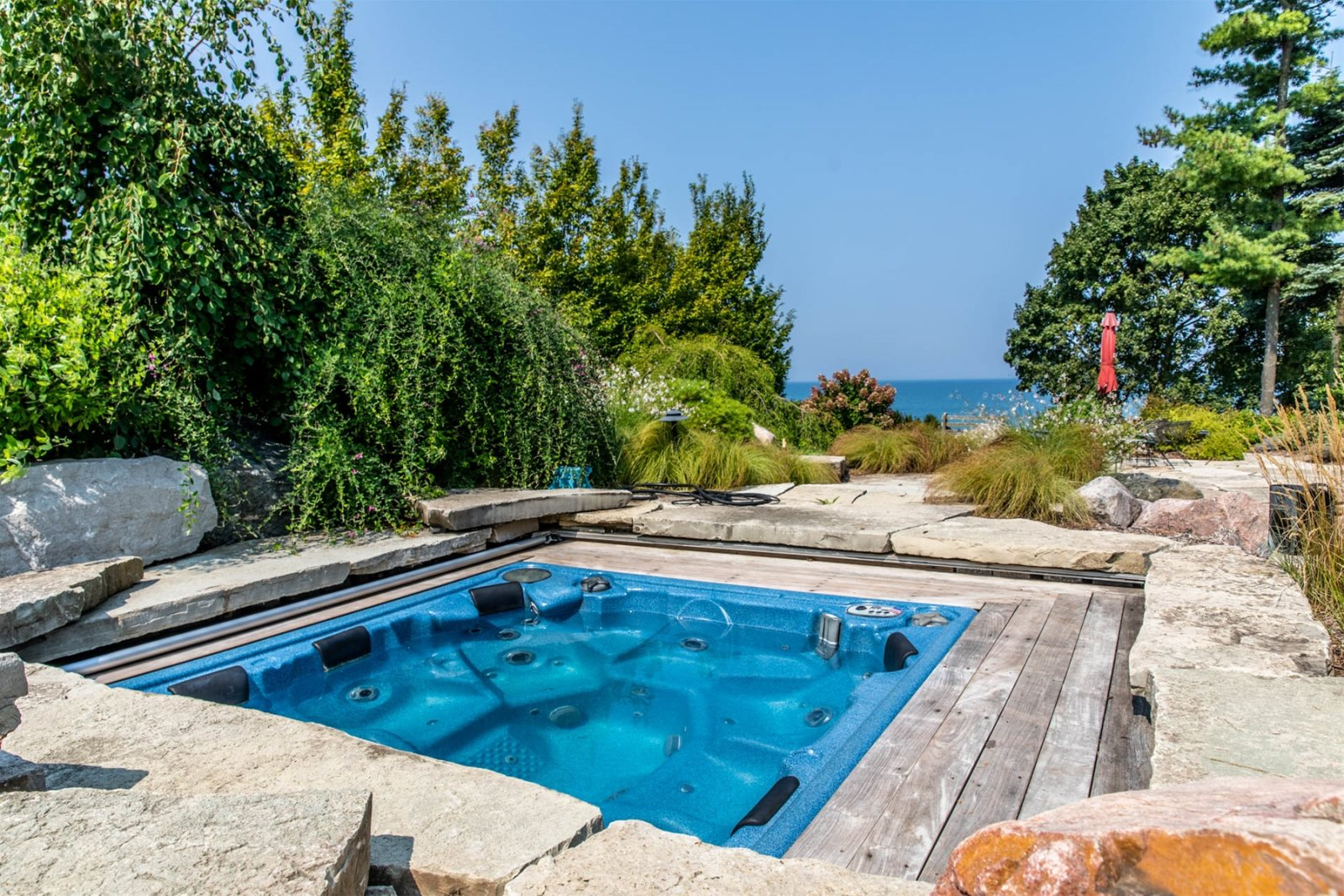 Outdoor hot tub of vacation home with views of Lake Michigan