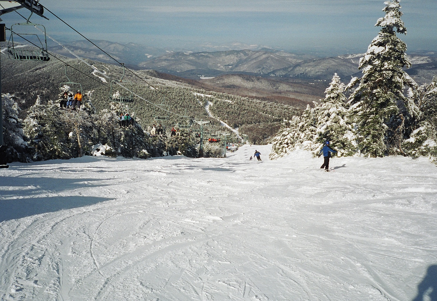 skiers going down a run at North Ridge of Killington Resort