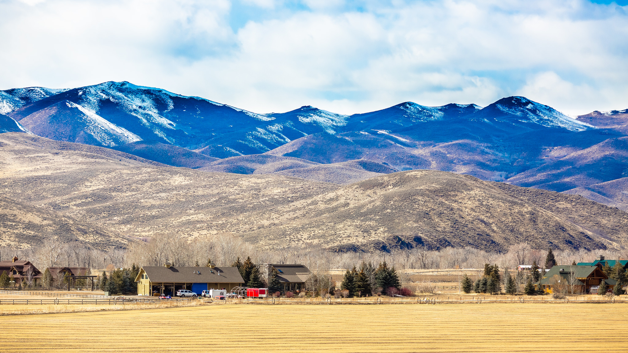 a view of a mountain range from the valley in Mccall, Idaho
