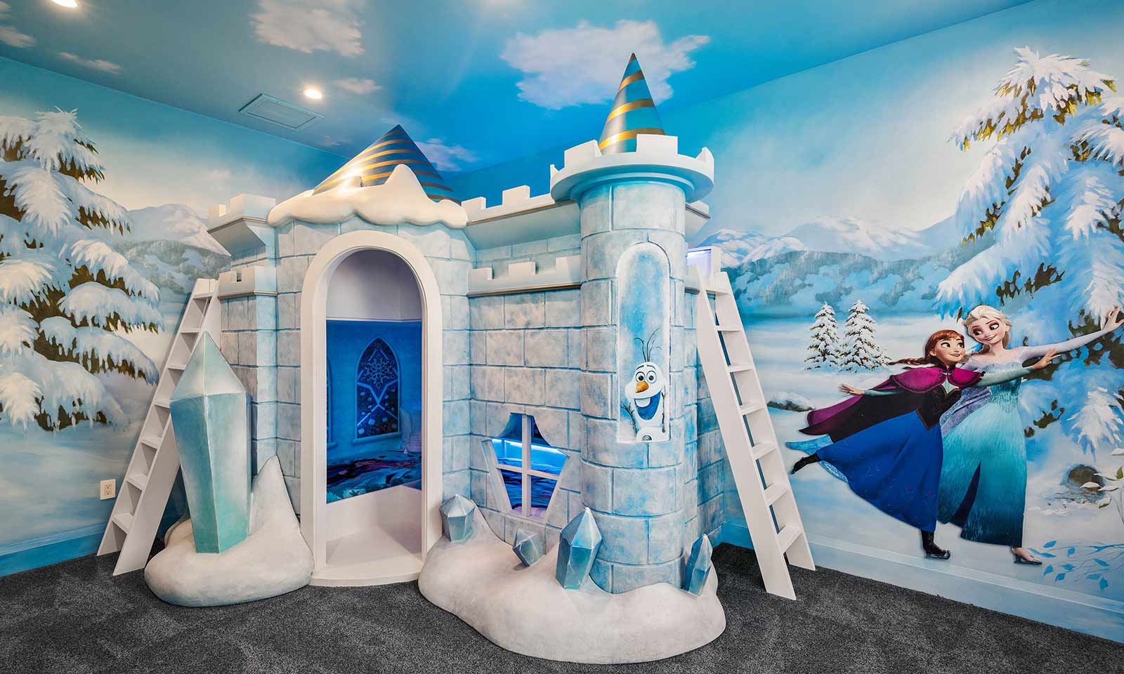 frozen themed bedroom with castle bed and Ana and Elsa artwork