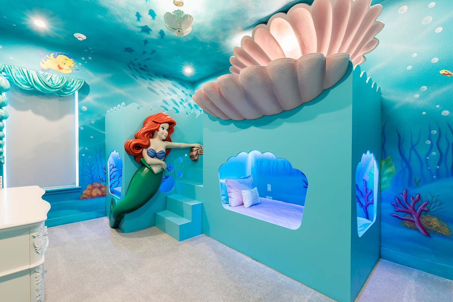 A kids room with a Little Mermaid theme at a vacation rental near Disney World in Florida.