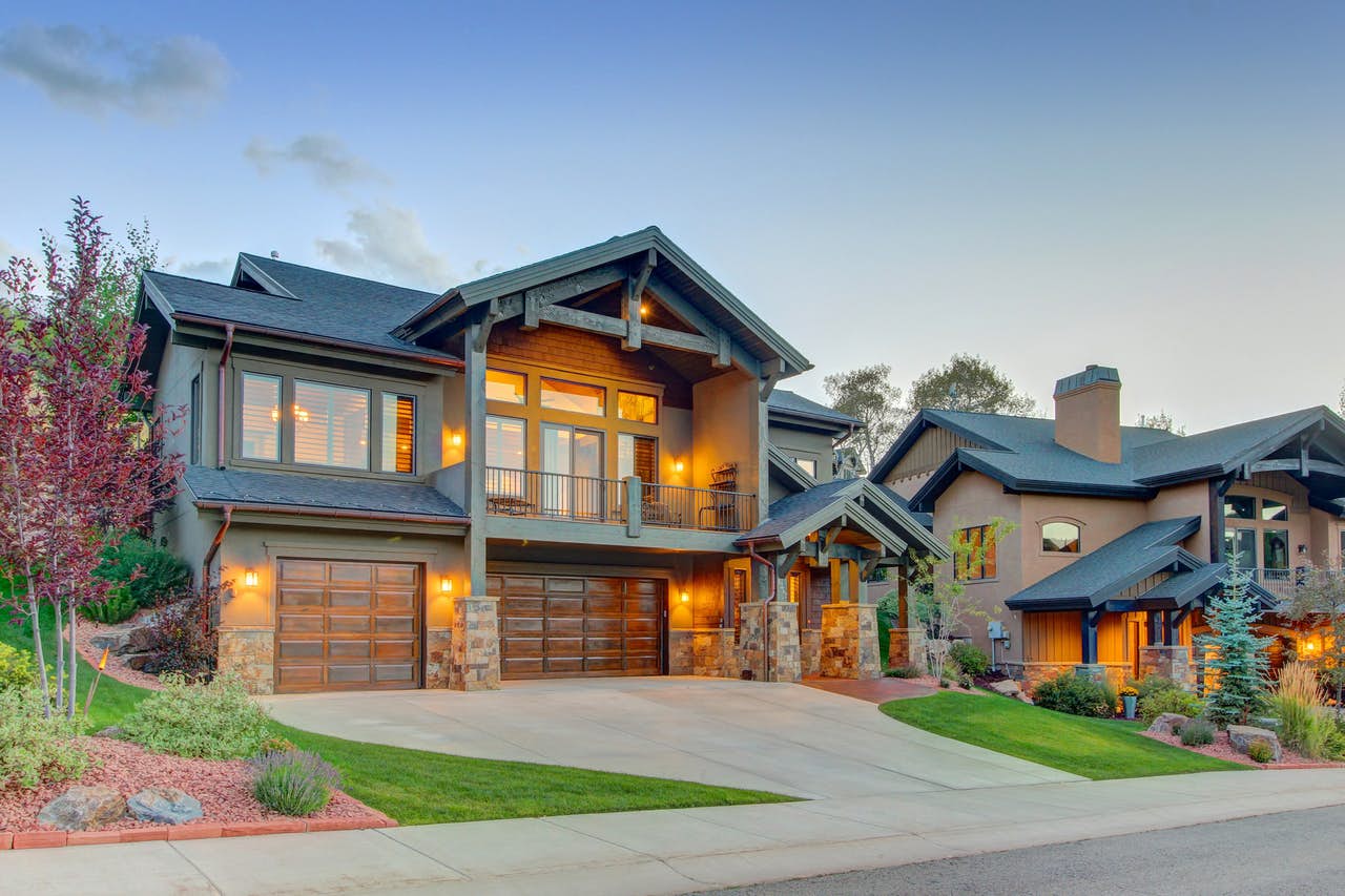 vacation home in park city with three car garage and landscaped lawn