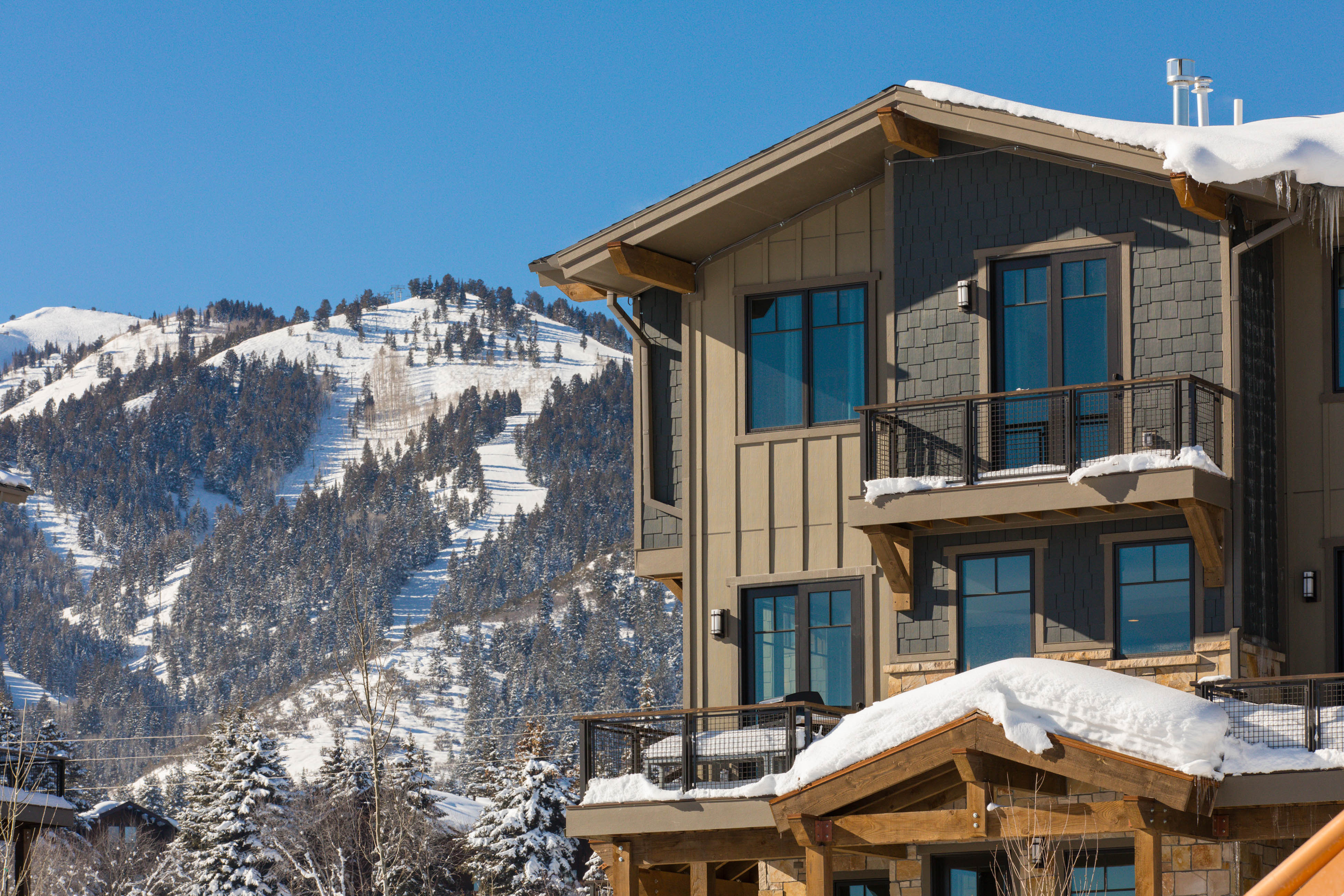 Park City, UT vacation rental with snowy mountain slopes in the background