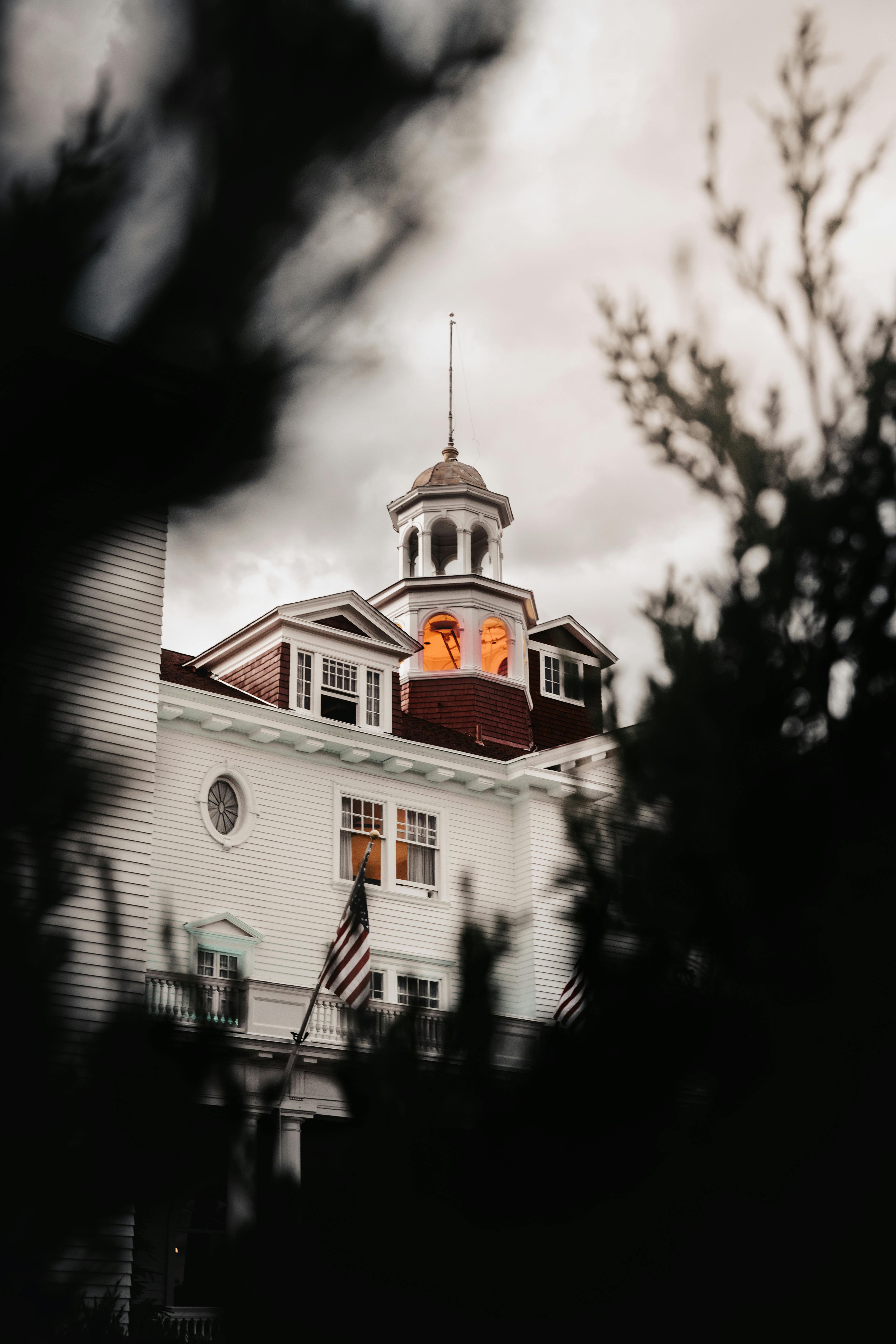 View of a house taken through trees.