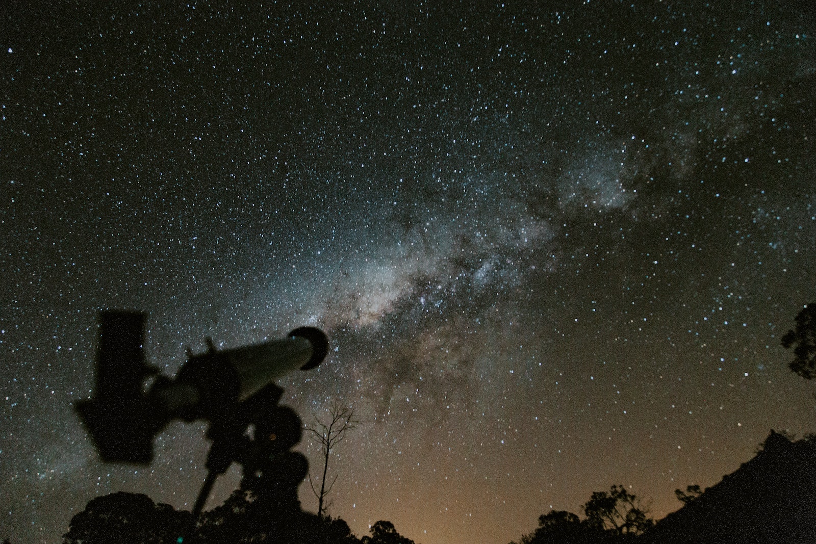 Telescope looking up at the Milky Way at night.