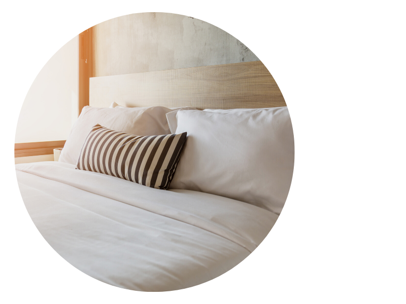 Clean bed linens with simple pillow