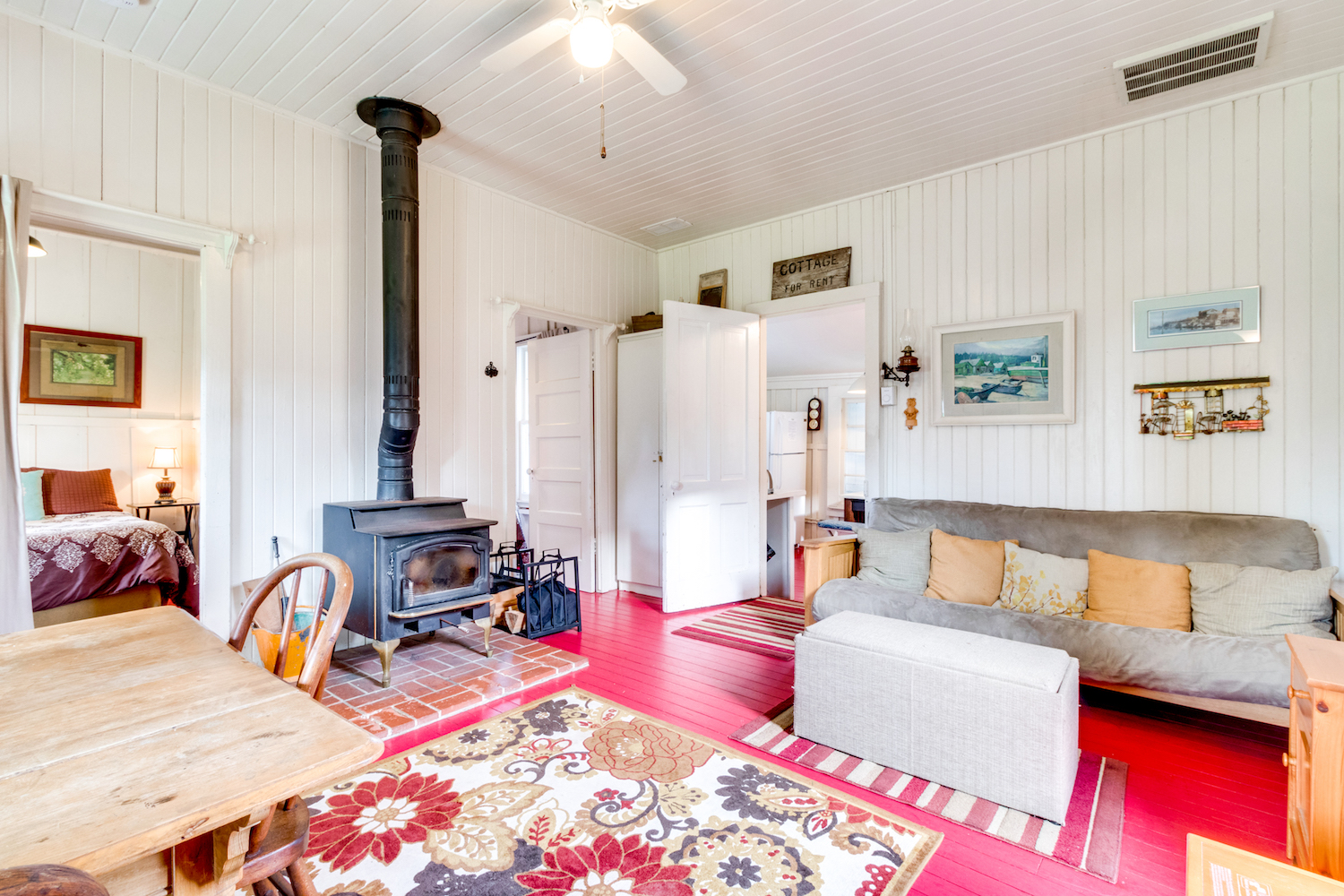 bright living room with an old fireplace