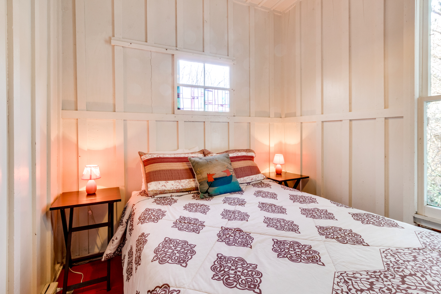 a made bed in a vacation home