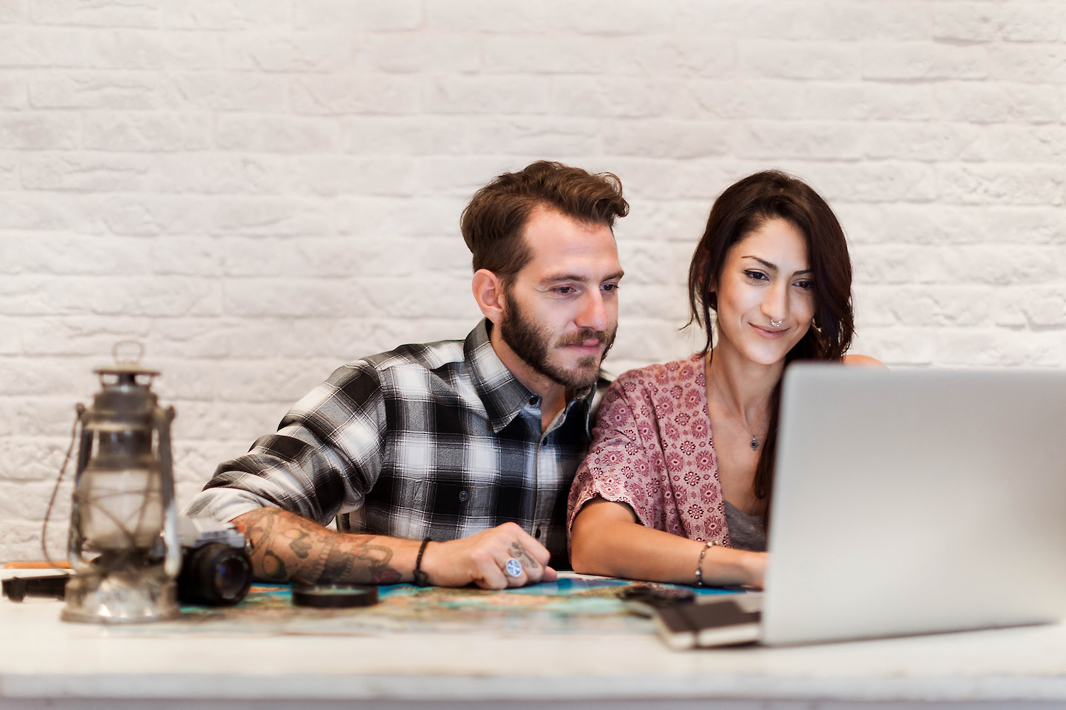 a couple viewing a laptop together