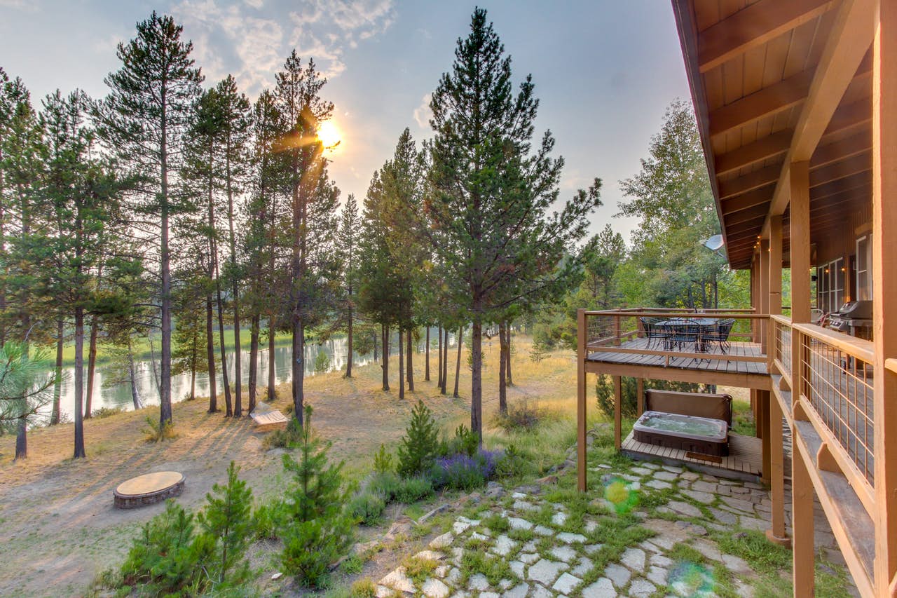 Oregon riverfront vacation rental deck surrounded by woods
