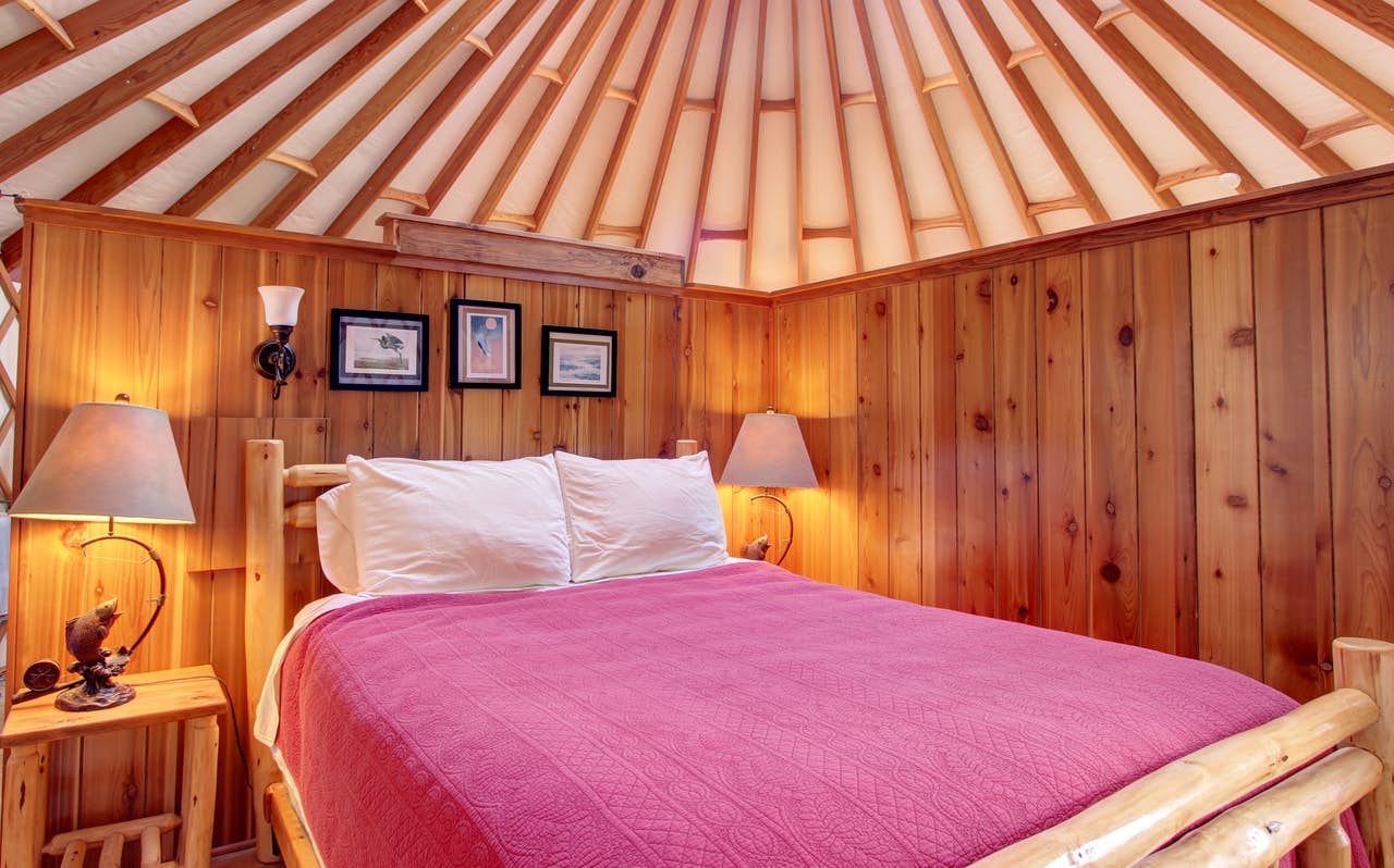 a cozy bedroom inside of a yurt in bay city, oregon