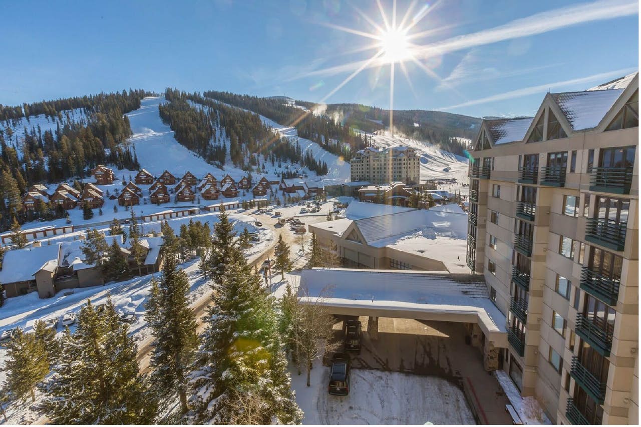 the exterior of an upscale resort in big sky that is close to the ski hills