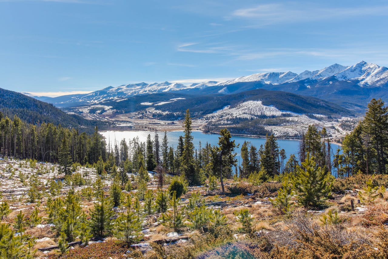 a view of the lake as the snow begins to melt in Keystone, CO