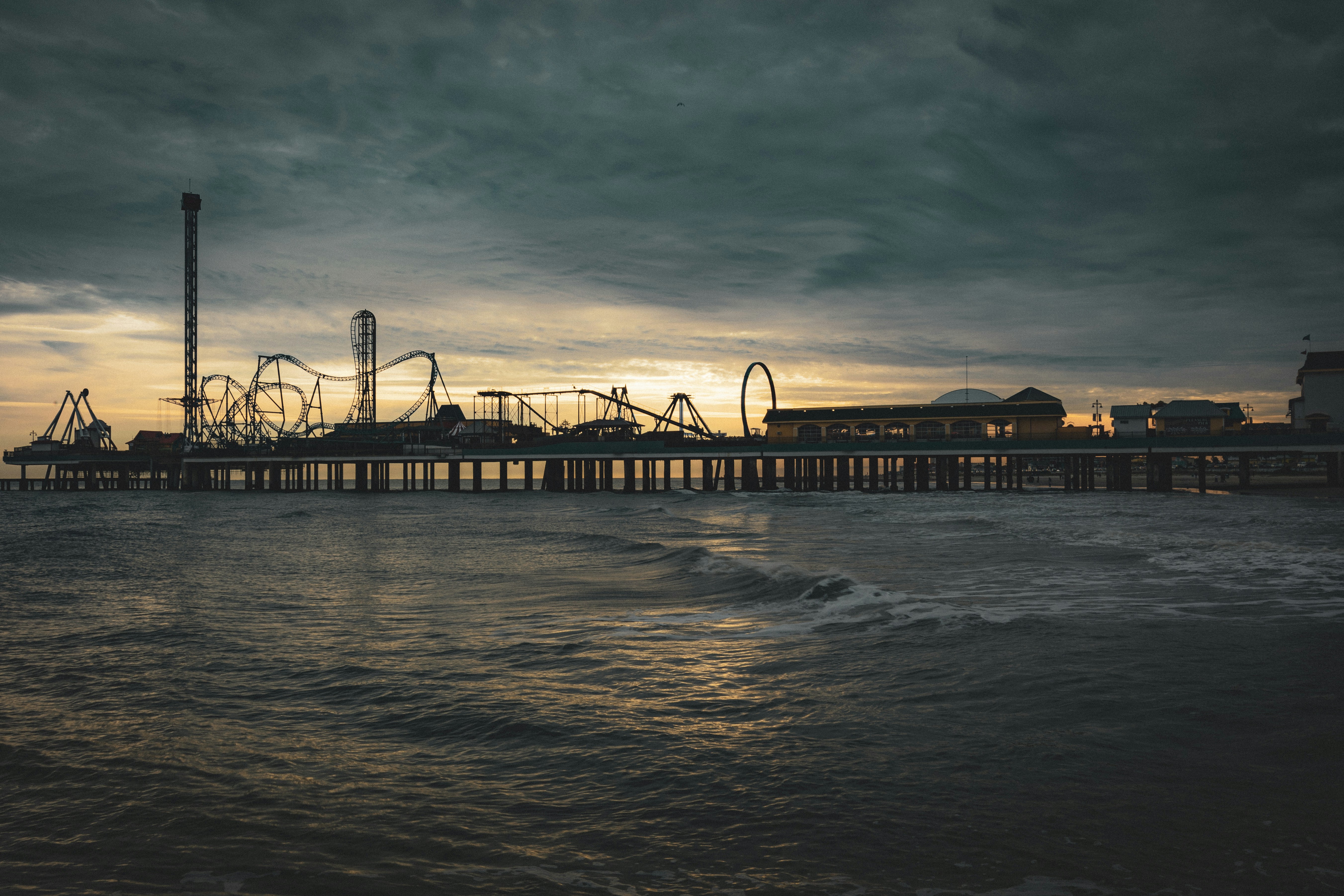 Galveston amusement park pier at dusk.